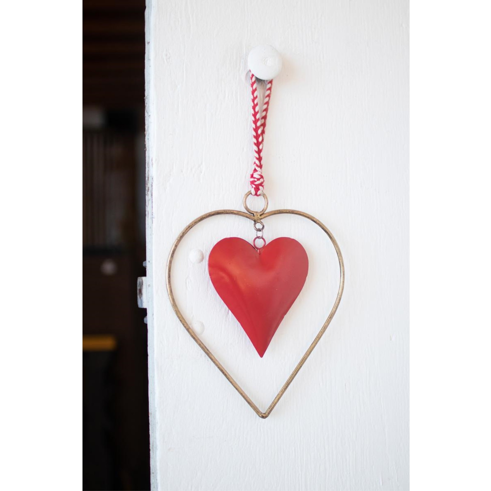 ANTIQUE BRASS AND RED HEART DOOR HANGER