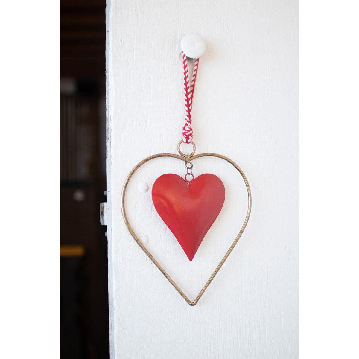ANTIQUE BRASS AND RED HEART DOOR HANGER