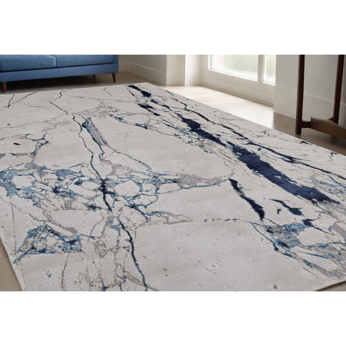 5' X 8' Ivory and Blue Marble Power Loom Distressed Area Rug