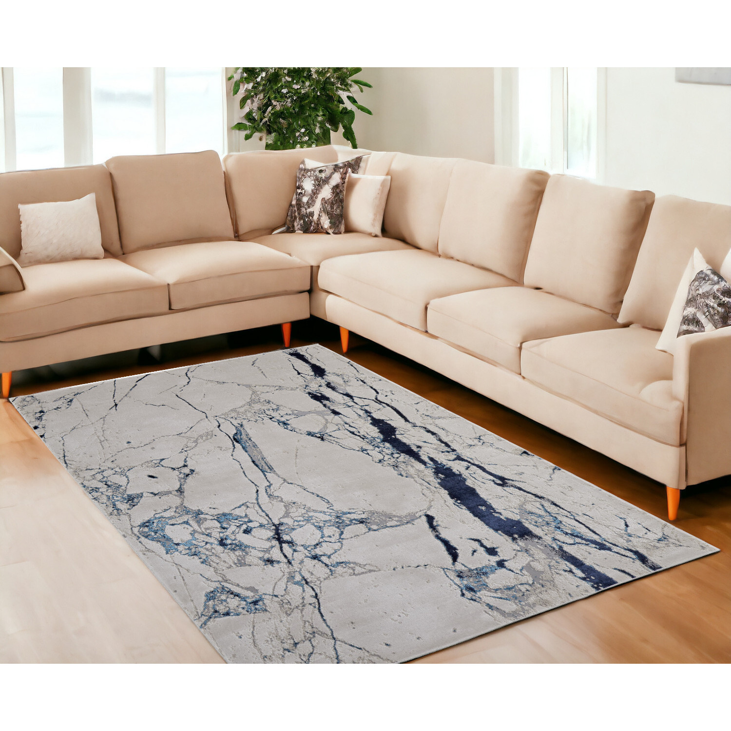 7' X 10' Ivory and Blue Marble Power Loom Distressed Area Rug