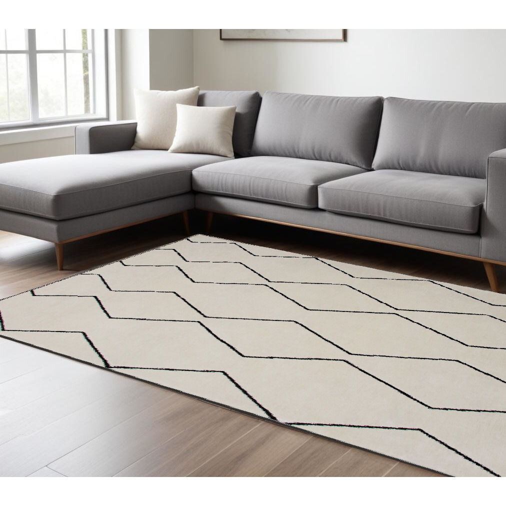 7' X 10' Beige and Black Geometric Power Loom Distressed Area Rug