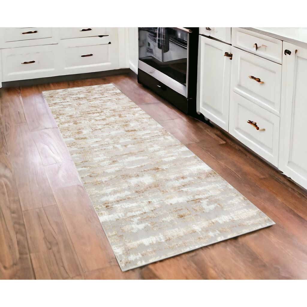 10' Gold and Ivory Abstract Washable Non Skid Area Rug