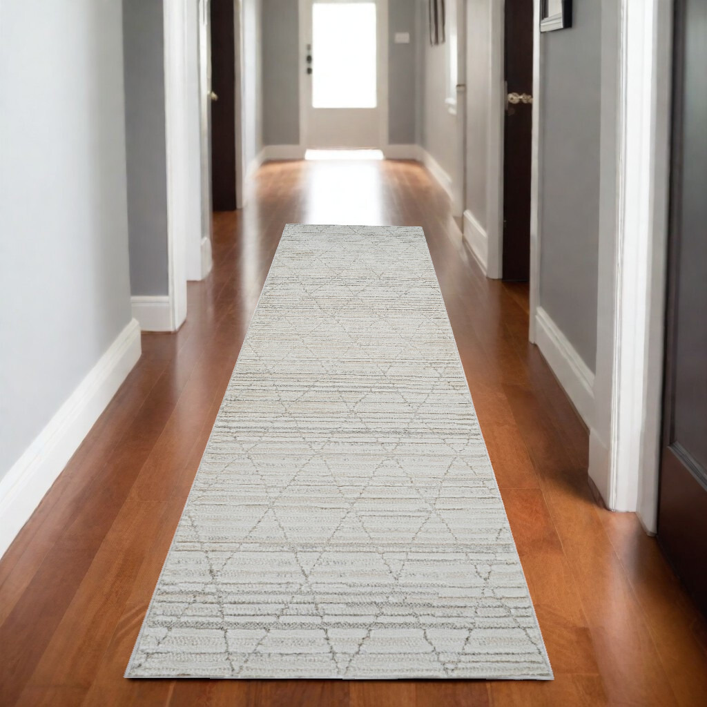 8' Gray and Beige Geometric Distressed Area Rug