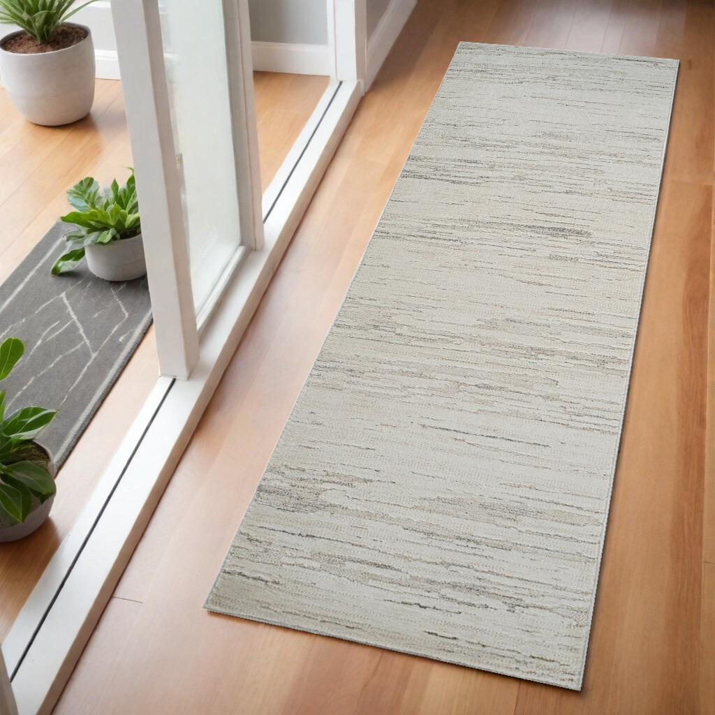 2' X 5' Gray and Beige Geometric Distressed Area Rug