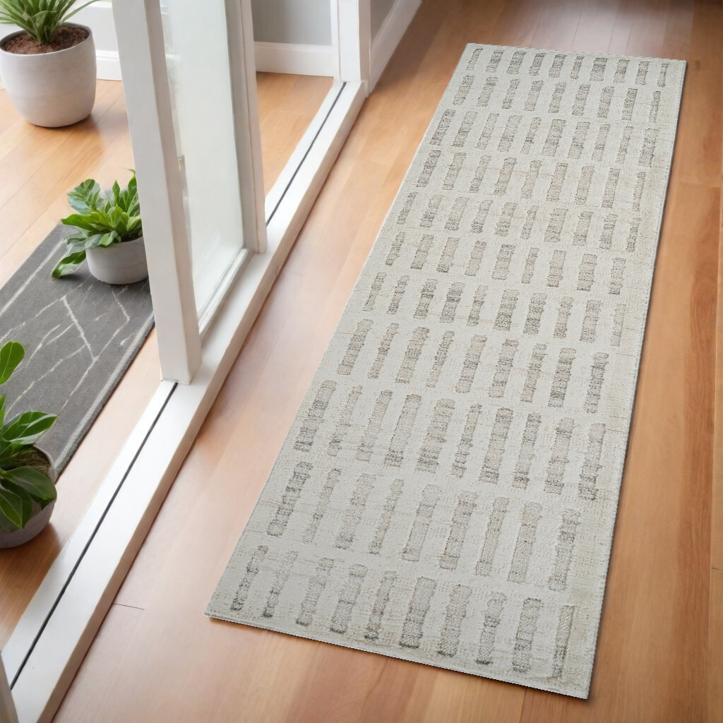 2' X 5' Gray and Beige Geometric Distressed Area Rug