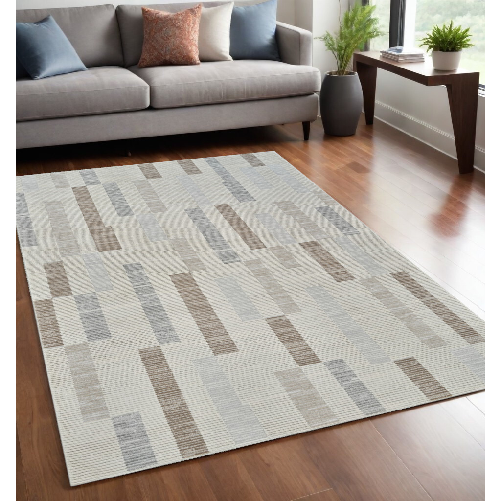 5' X 8' Beige and Brown Abstract Distressed Area Rug