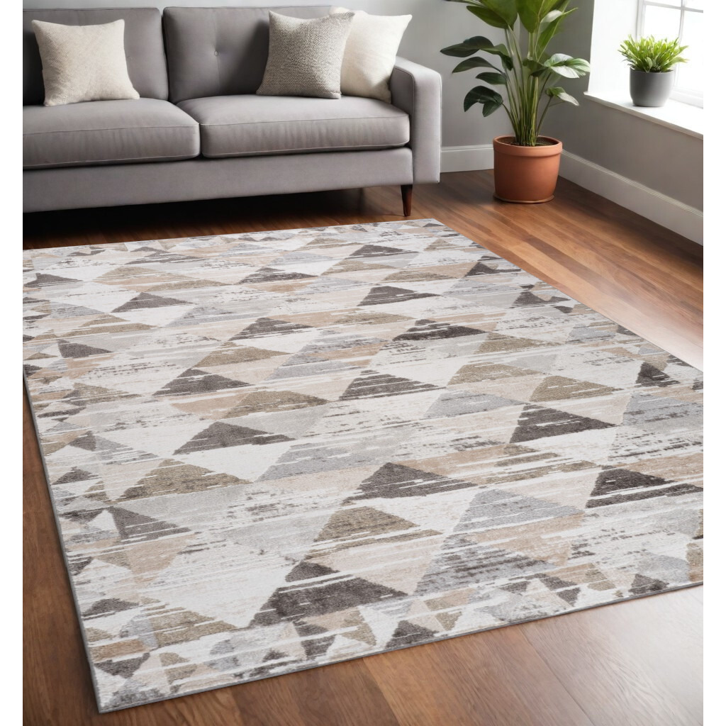 5' X 8' Beige and Brown Abstract Distressed Area Rug