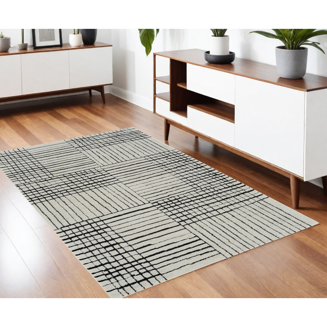 4' X 6' Cream and Black Abstract Distressed Area Rug