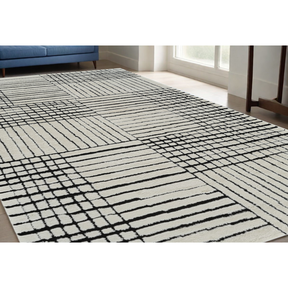 5' X 8' Cream and Black Abstract Distressed Area Rug