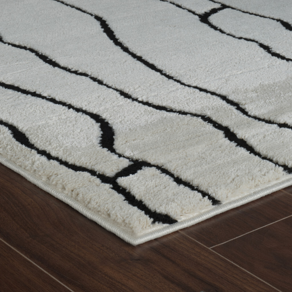 8' X 11' Cream and Black Abstract Distressed Area Rug