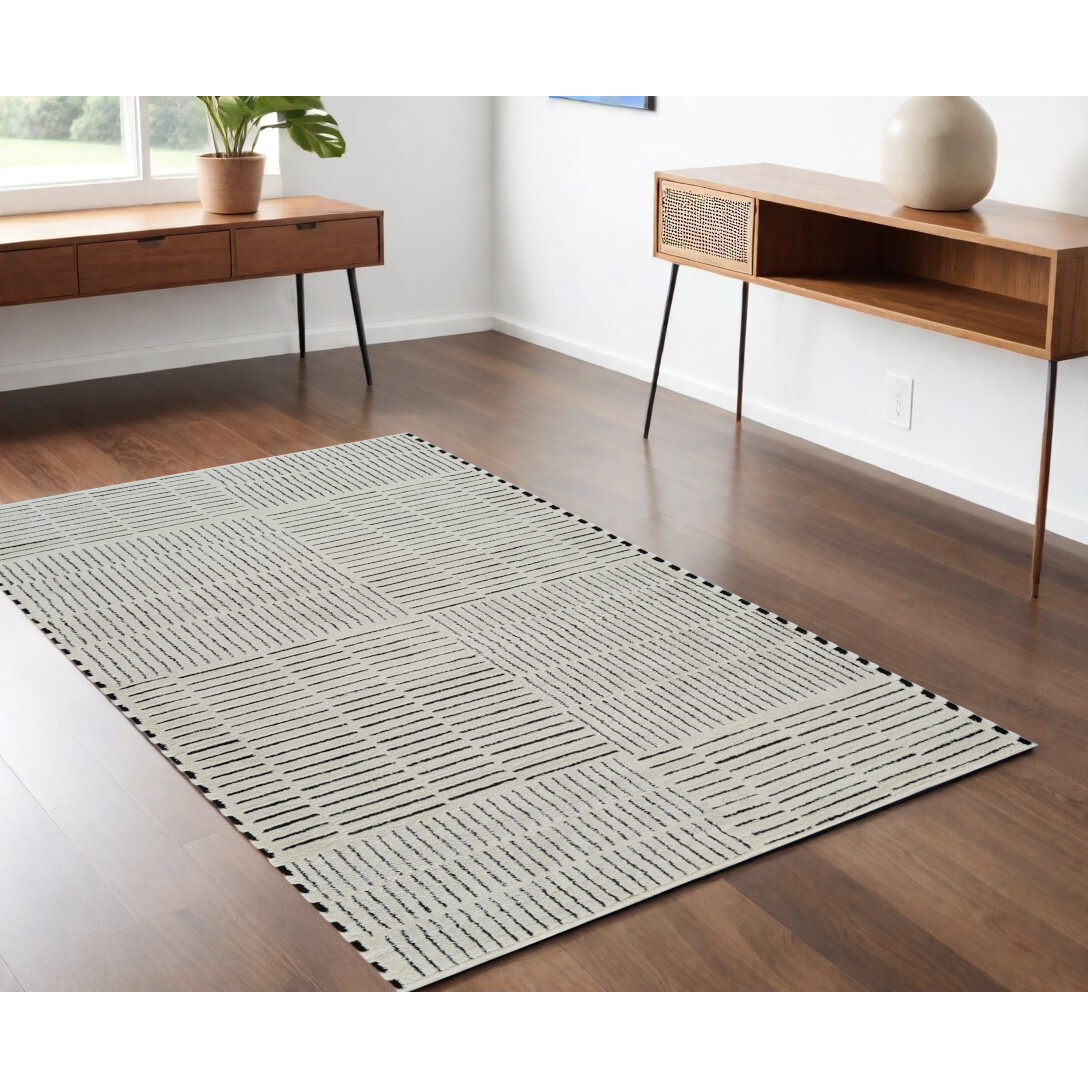 4' X 6' Cream and Black Abstract Distressed Area Rug