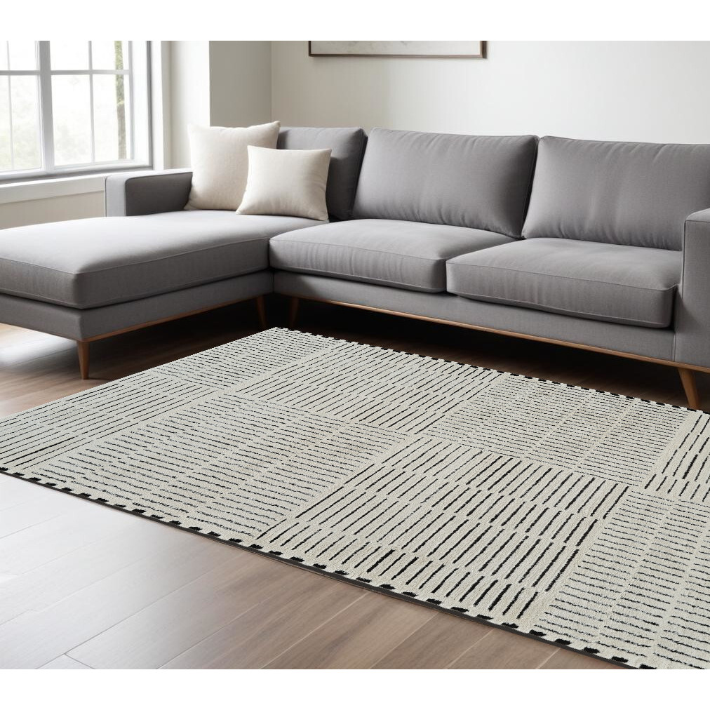 8' X 11' Cream and Black Abstract Distressed Area Rug
