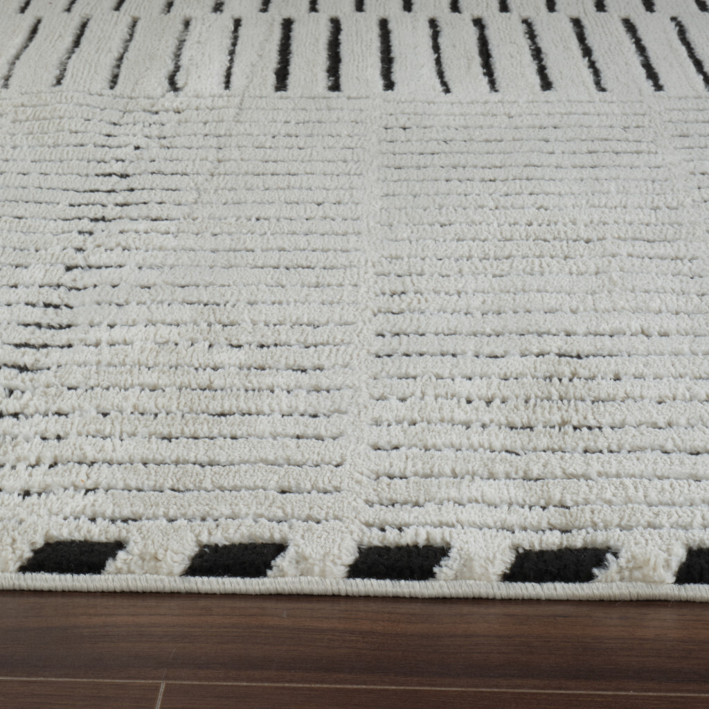 8' X 11' Cream and Black Abstract Distressed Area Rug