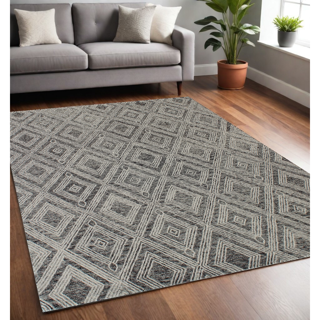 5' X 8' Black and Ivory Wool Abstract Geometric Hand Tufted Non Skid Area Rug