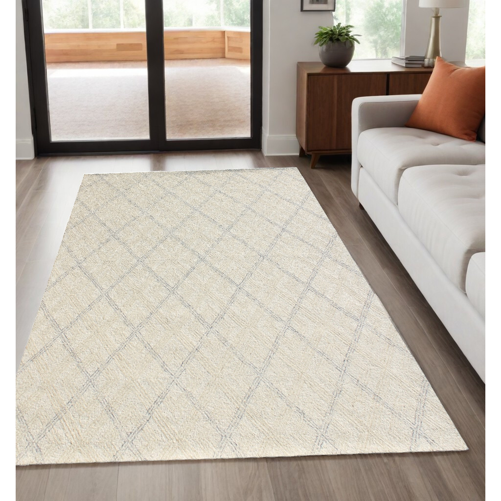 5' X 8' Ivory Wool Abstract Geometric Hand Tufted Non Skid Area Rug
