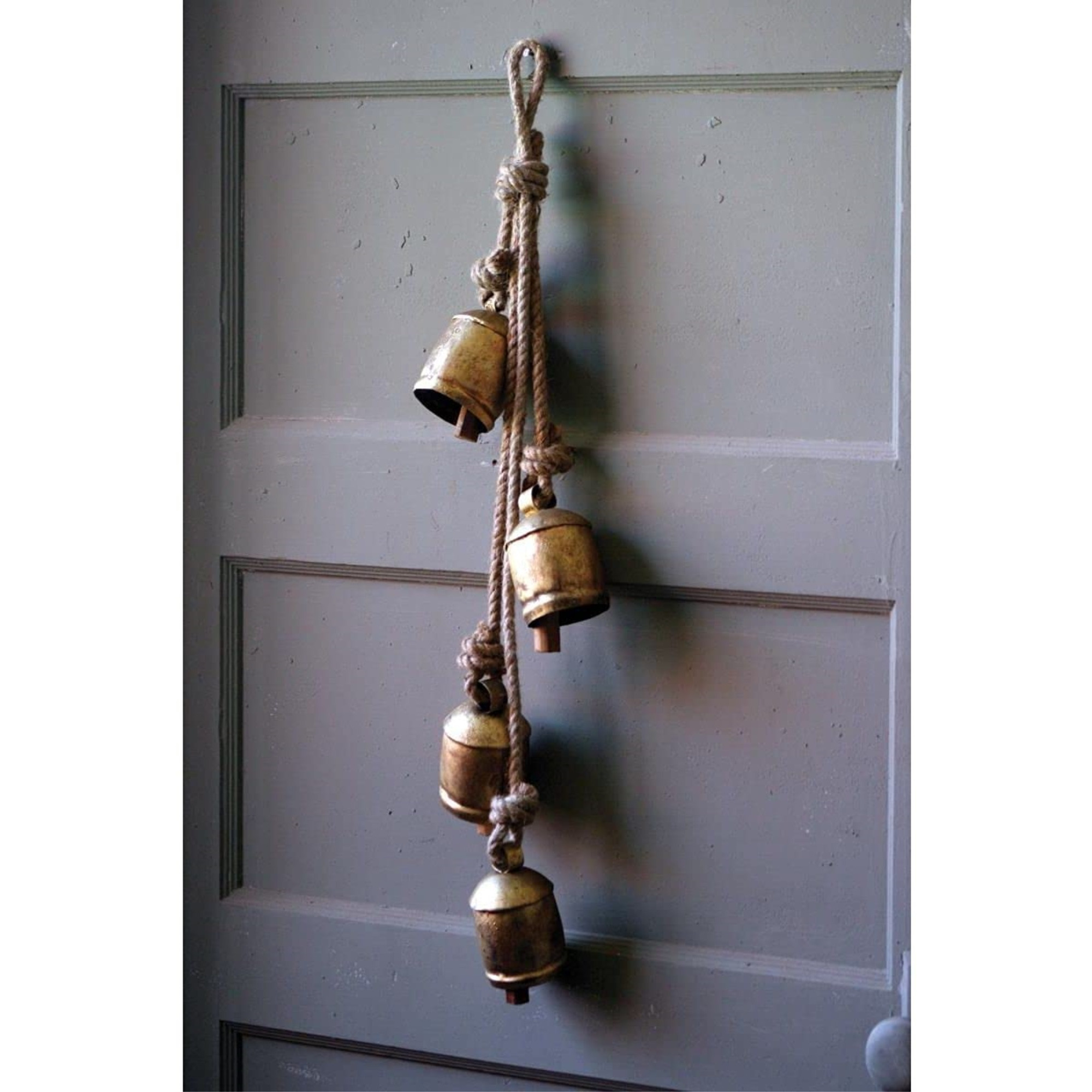 FOUR RUSTIC IRON HANGING BELLS WITH ROPE