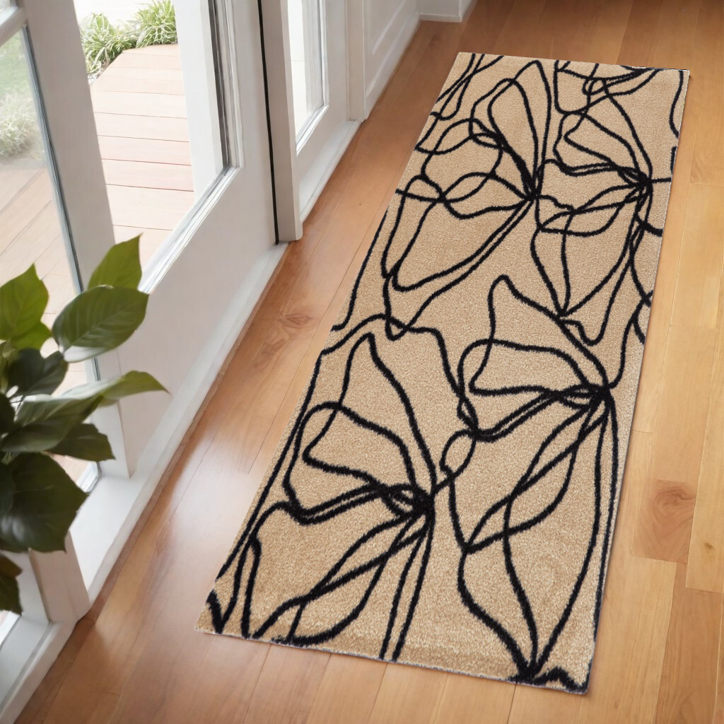 6' Beige and Black Floral Washable Runner Rug With UV Protection