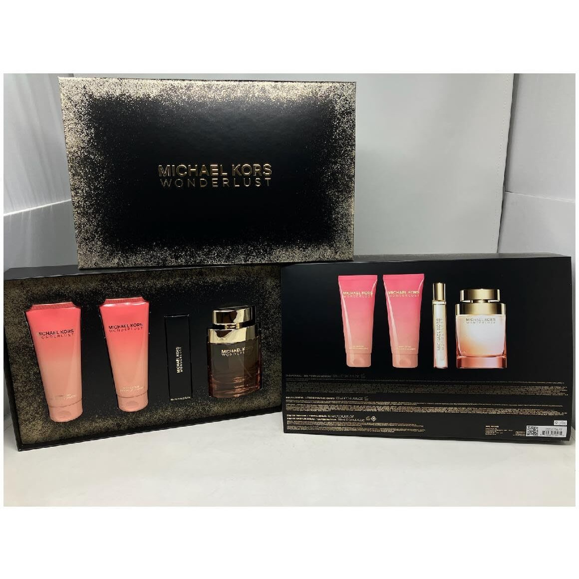 Michael Kors Wonderlust 4 Pcs Set For Women 3.4 Eau De Parfum Spray + 0.3 Eau De Parfum Spray + 3.4 Shower Gel + 3.4 Body Lotion