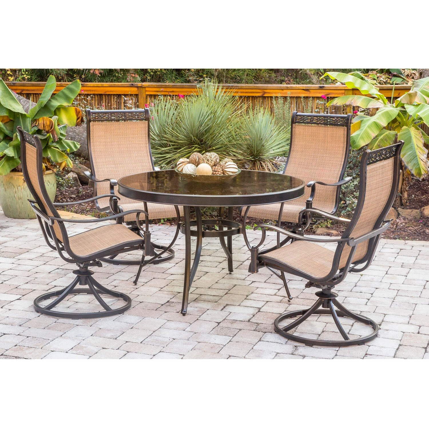 Hanover Monaco 5-Piece Outdoor Dining Set With 4 Tan Sling Swivel Rocker Chairs And 47"" Round Glass-Top Table, Bronze Rust Resistant Finish, Outdoor Dining Set For 4, All-Weather Patio Dining Set