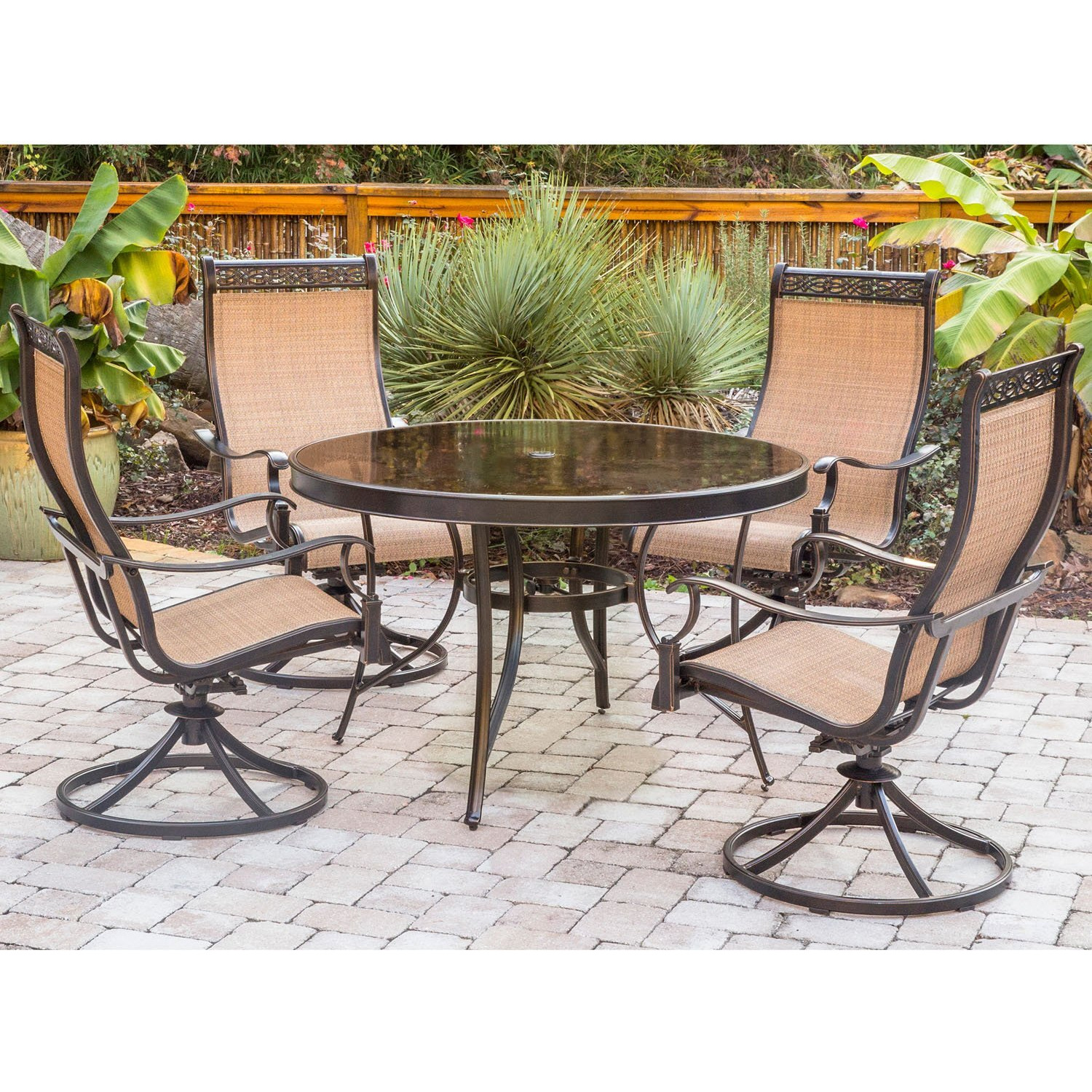 Hanover Monaco 5-Piece Outdoor Dining Set With 4 Tan Sling Swivel Rocker Chairs And 47"" Round Glass-Top Table, Bronze Rust Resistant Finish, Outdoor Dining Set For 4, All-Weather Patio Dining Set
