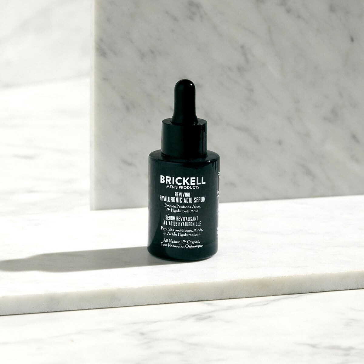 Brickell Men's Anti Aging Hyaluronic Acid Serum For Face, Reviving Day Serum For Men, Natural And Organic Face Serum With Protein Peptides To Restore Firmness And Collagen, 1 Ounce, Scented