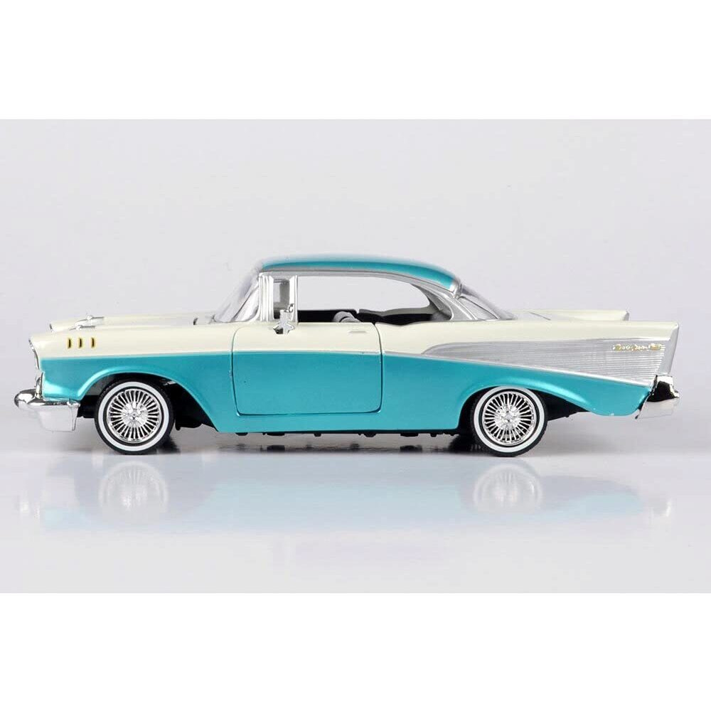 1957 Chevrolet Bel Air Lowrider Turquoise Metallic and White &quotGet Low" Series 1/24 Diecast Model Car by Motormax