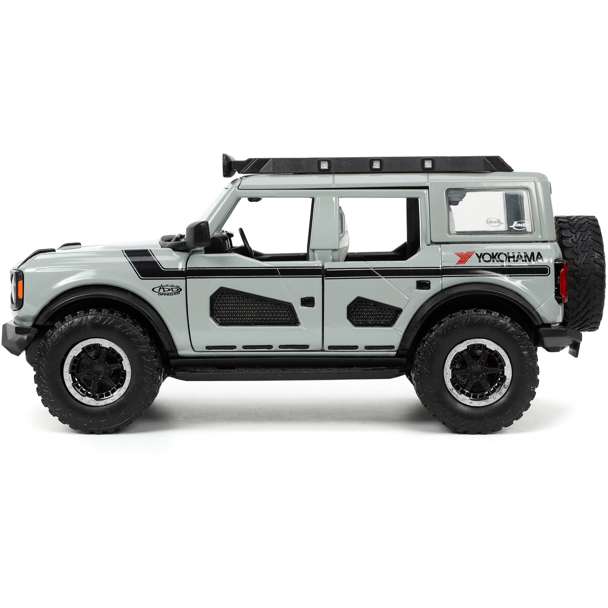 2021 Ford Bronco Gray with Black Stripes with Roof Rack &quotOwn the Night" &quotJust Trucks" Series 1/24 Diecast Model Car by Jada