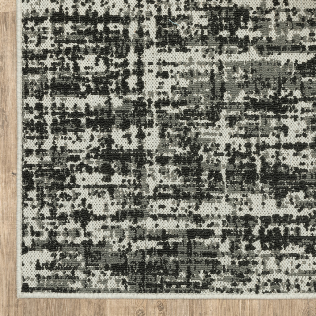 2 X 7 Beige and Black Abstract Stain Resistant Indoor Outdoor Area Rug