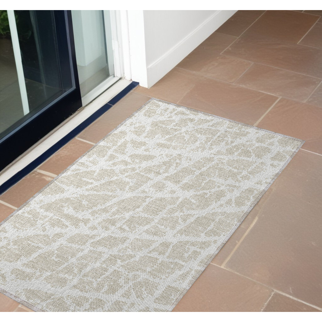 2' X 3' Beige and Ivory Abstract Washable Non Skid Indoor Outdoor Area Rug