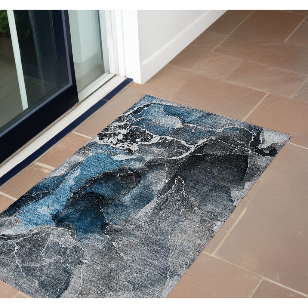 2' X 3' Ivory Blue and Gray Abstract Washable Non Skid Indoor Outdoor Area Rug