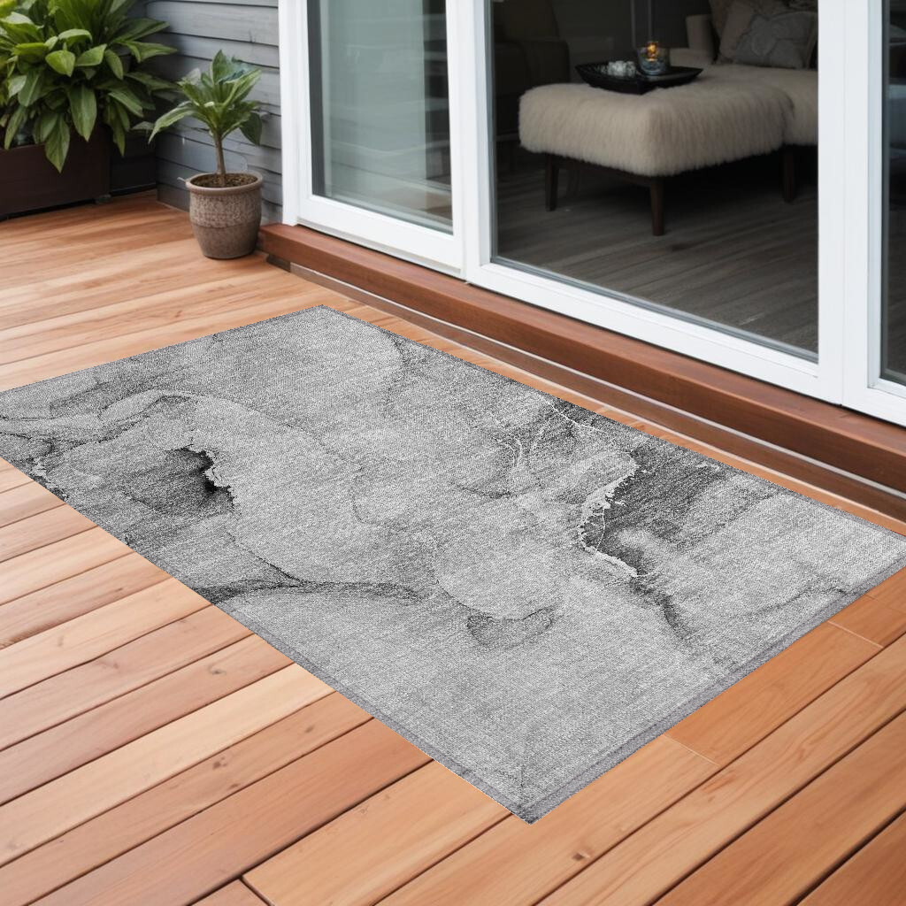 2' X 3' Gray and Ivory Abstract Washable Non Skid Indoor Outdoor Area Rug