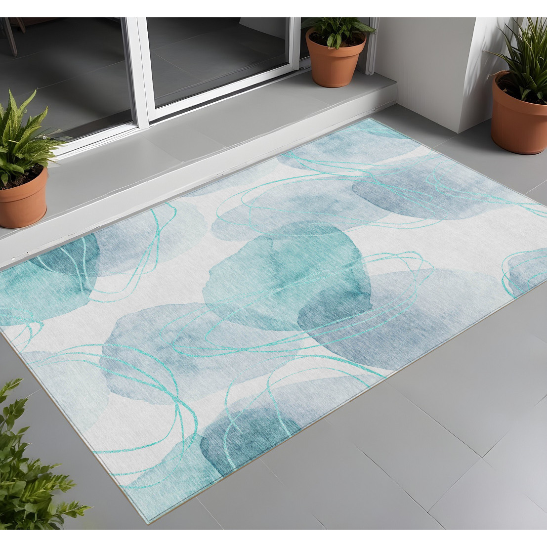 2' X 3' Teal and Ivory Abstract Washable Non Skid Indoor Outdoor Area Rug