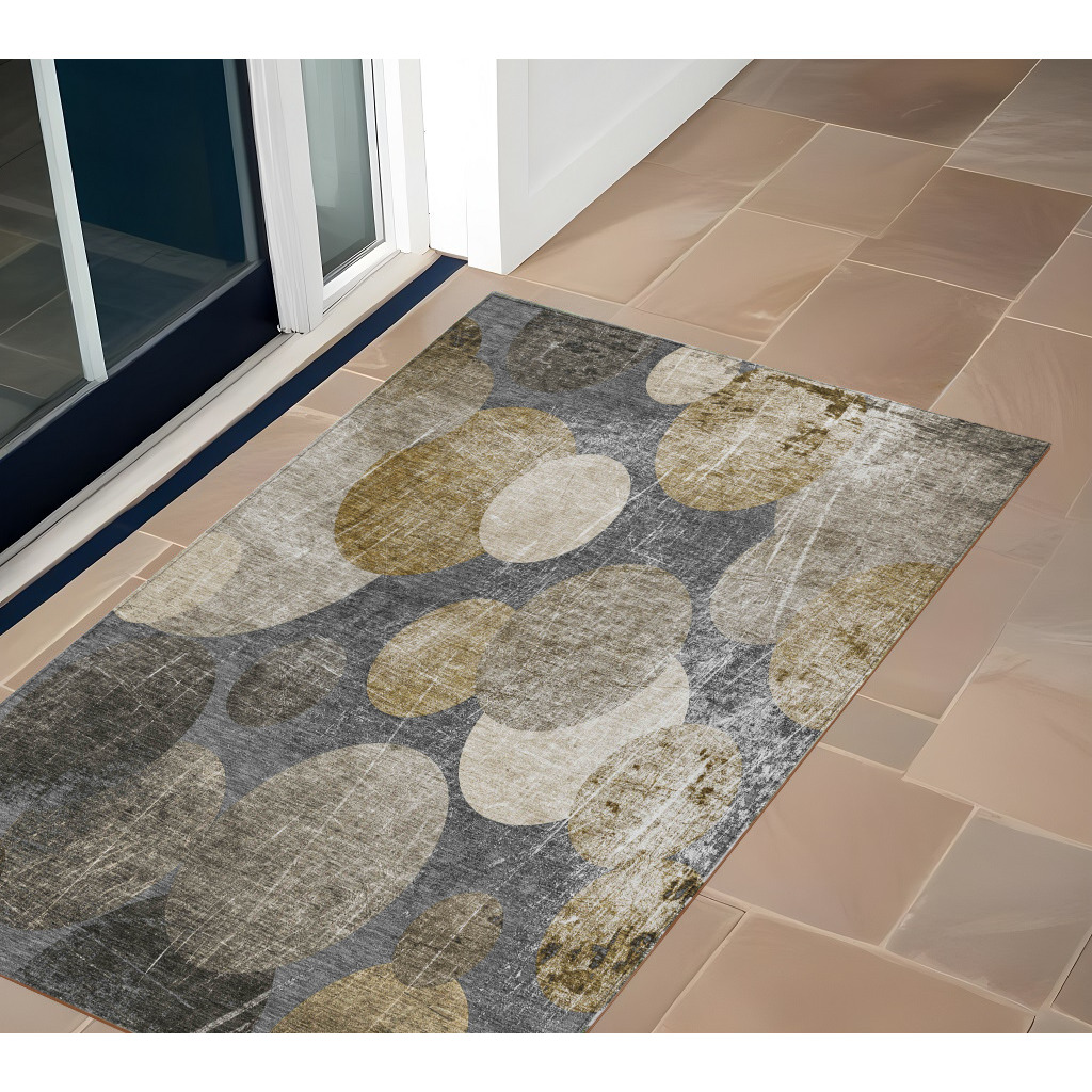 2' X 3' Brown Beige and Ivory Abstract Washable Non Skid Indoor Outdoor Area Rug