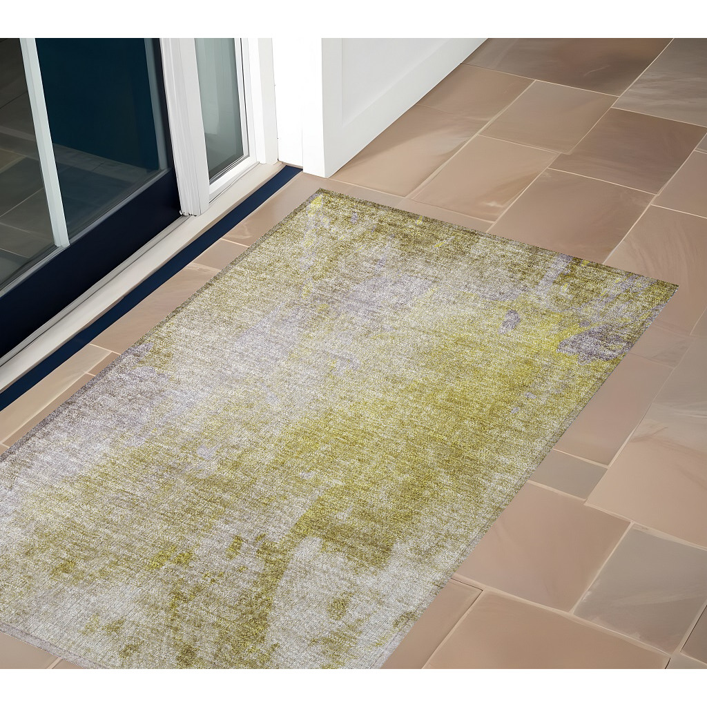 2' X 3' Gold Beige and Purple Abstract Washable Non Skid Indoor Outdoor Area Rug