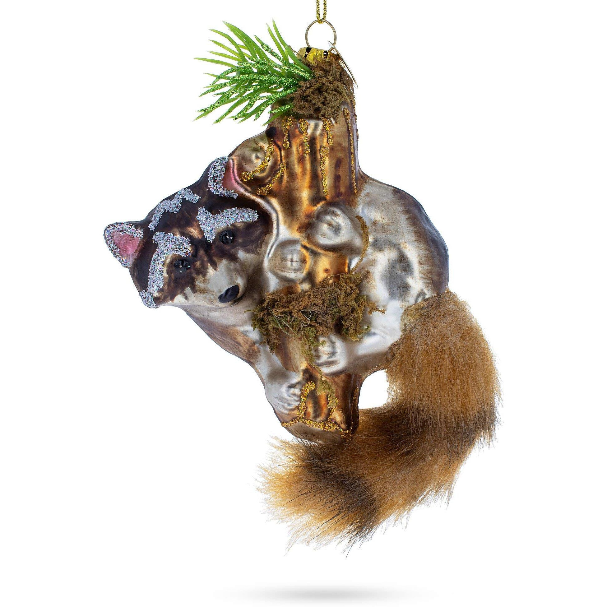 Curious Raccoon Climbing The Tree - Blown Glass Christmas Ornament