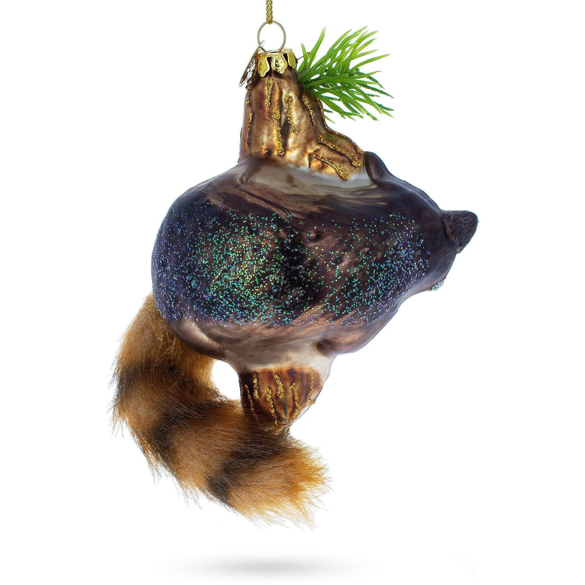 Curious Raccoon Climbing The Tree - Blown Glass Christmas Ornament