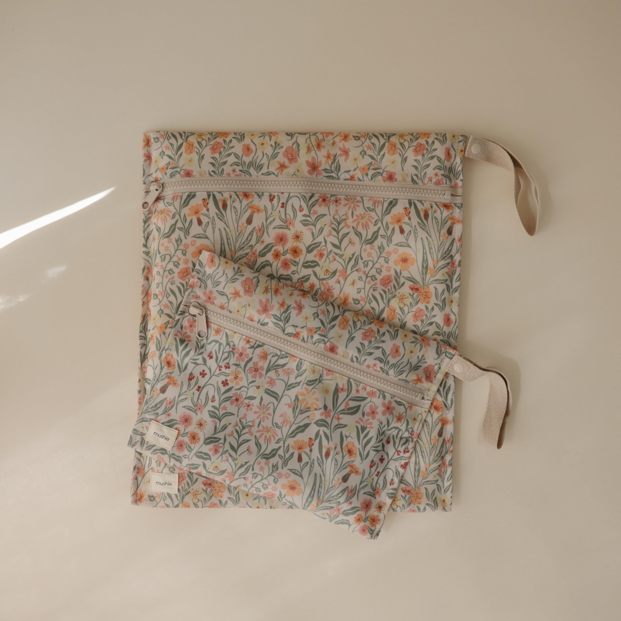 Mushie Water Resistant Wet Bags | Large & Small Reusable Storage Bag For Baby Items And Travel | Zippered Pockets With Handle | Machine Washable  Set Of 2 (Pastel Blooms)