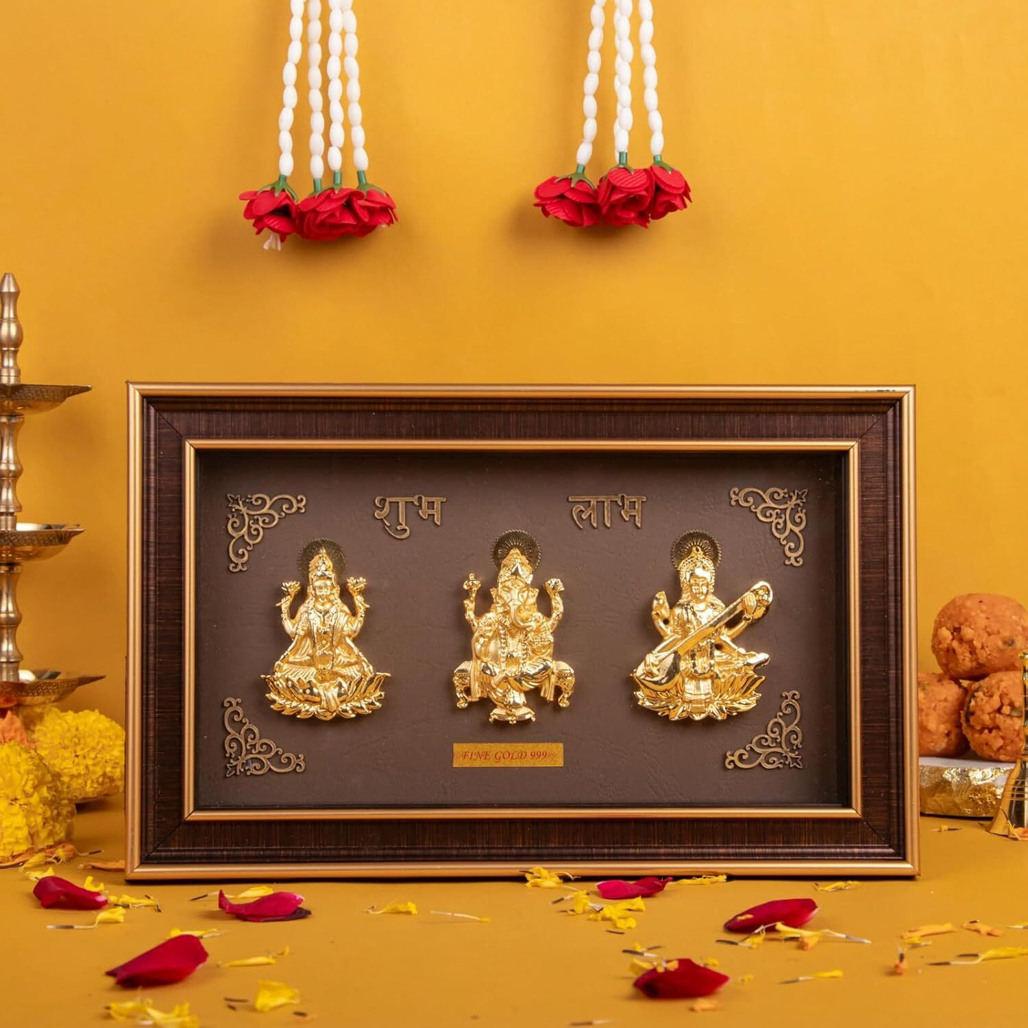 Golden Trimurti Photo Frame (Ganesha, Laxmi and Saraswati) - 10.5 x 6.5 Inches