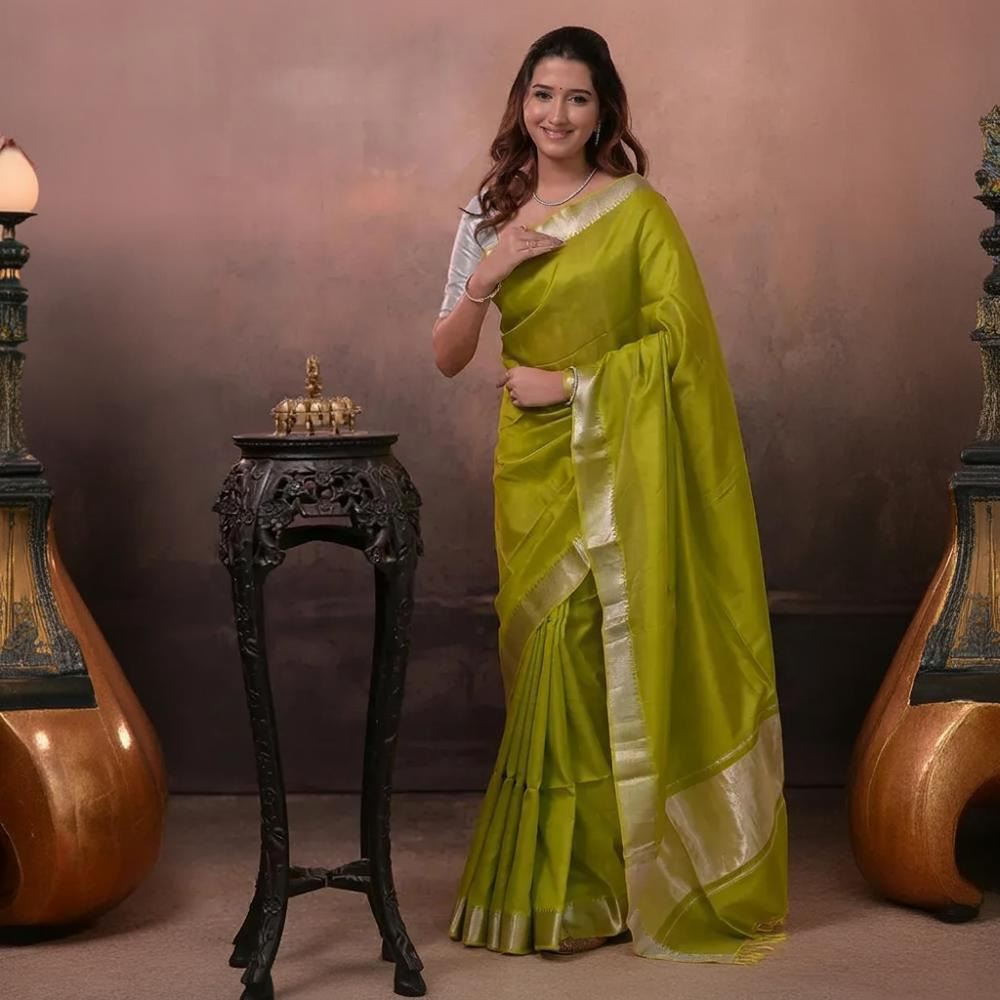 Bhadra - Lemon Green Plain Handwoven Silk Saree With Silver Zari Border