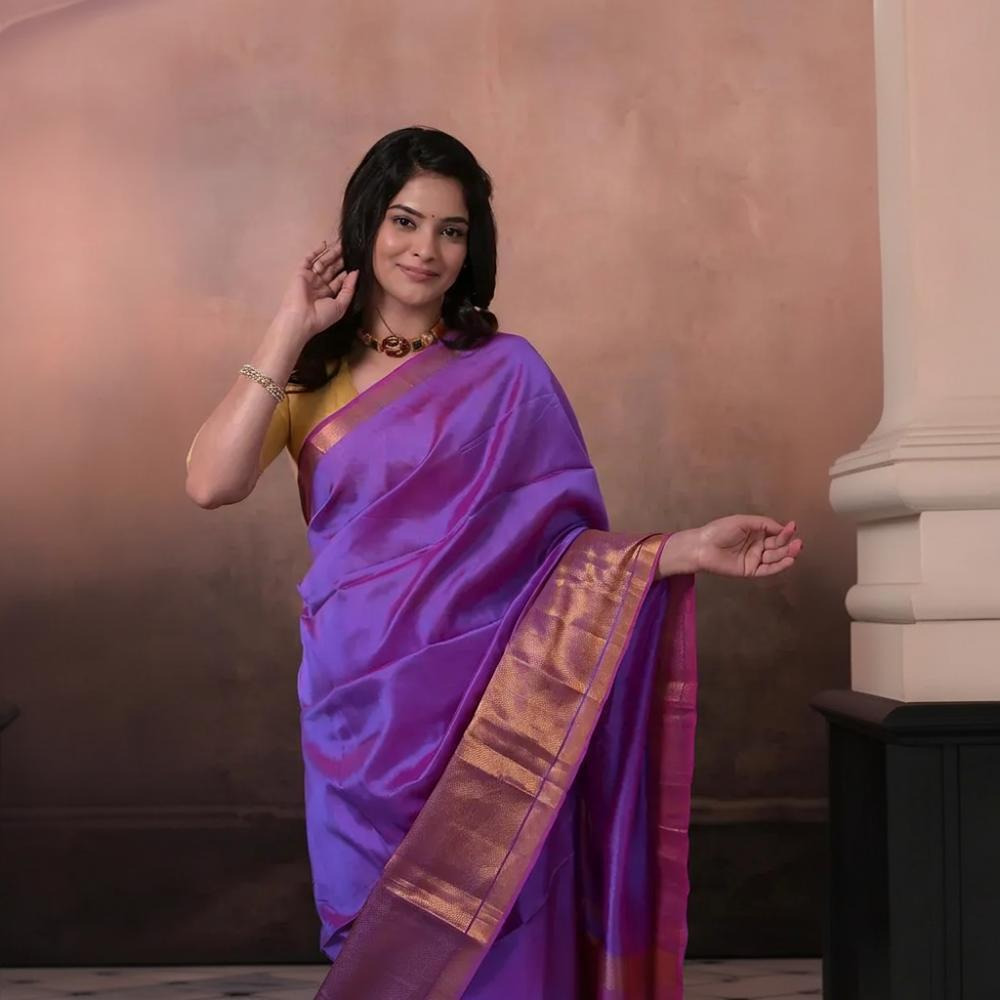 Bhadra - Lavender Pink Plain Handwoven Silk Saree With Gold Zari Border