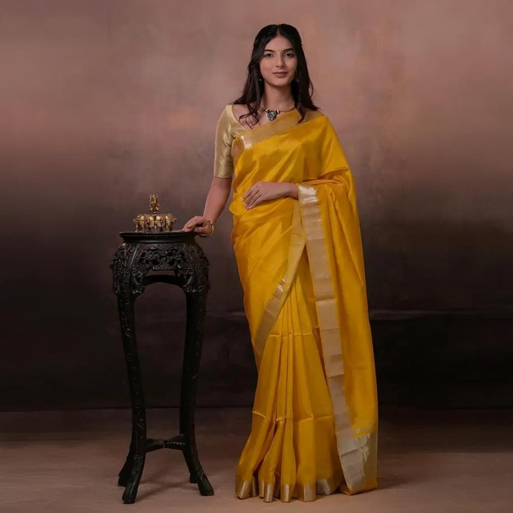 Bhadra - Turmeric Yellow Plain Handwoven Silk Saree With Silver Zari Border