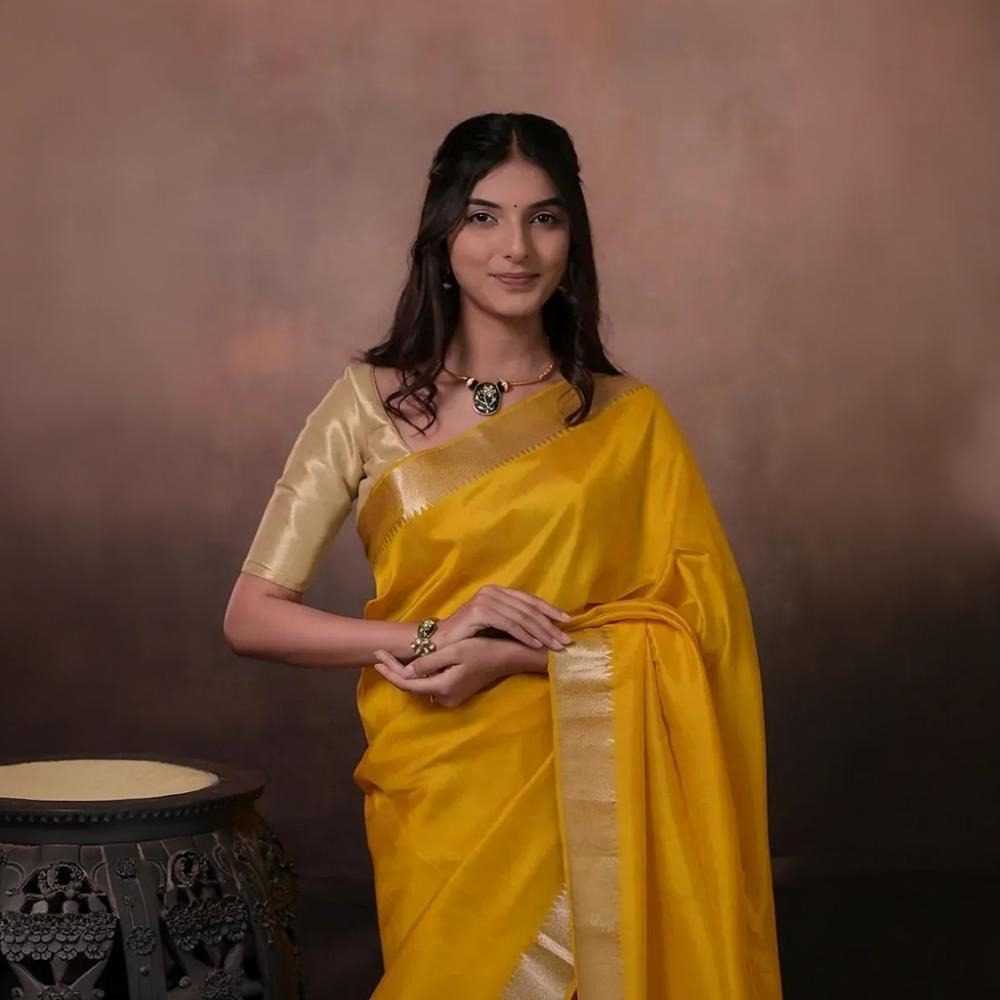 Bhadra - Turmeric Yellow Plain Handwoven Silk Saree With Silver Zari Border