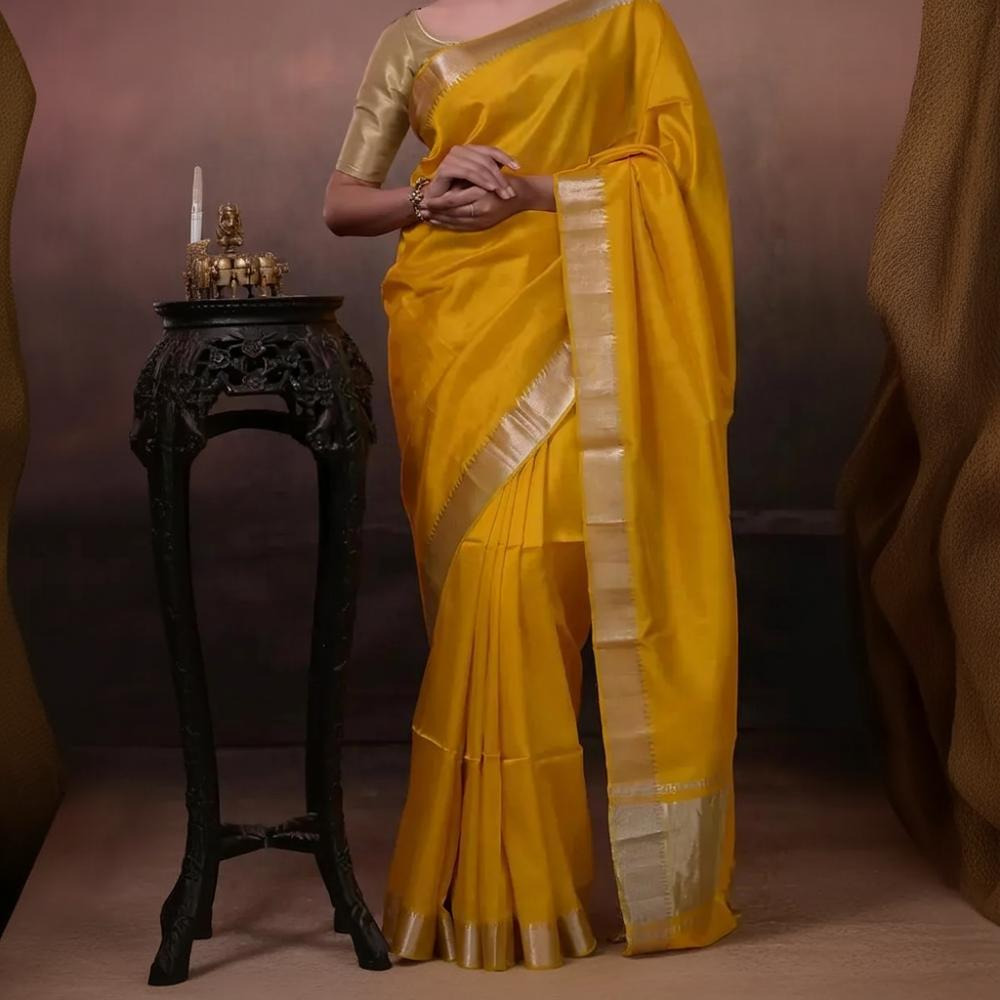 Bhadra - Turmeric Yellow Plain Handwoven Silk Saree With Silver Zari Border