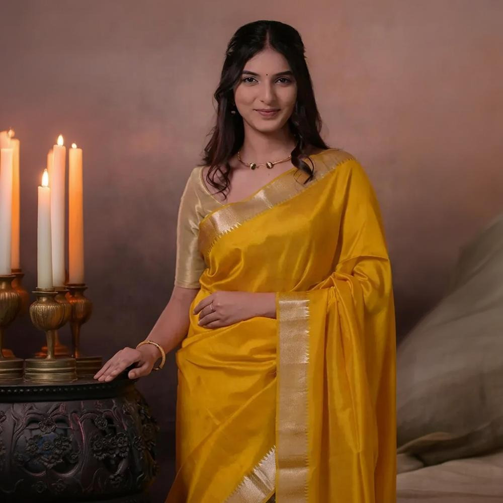 Bhadra - Turmeric Yellow Plain Handwoven Silk Saree With Silver Zari Border