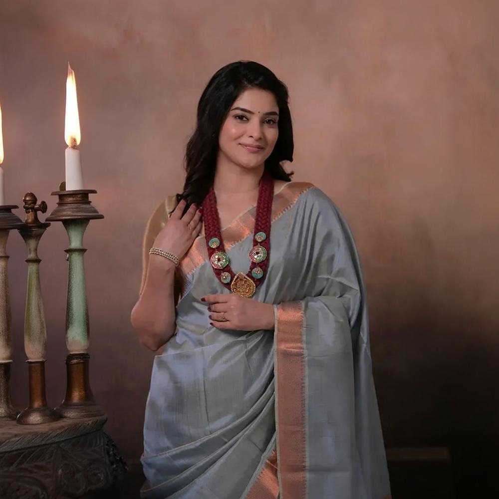 Bhadra - Powder Blue Plain Handwoven Silk Saree With Copper Zari Border