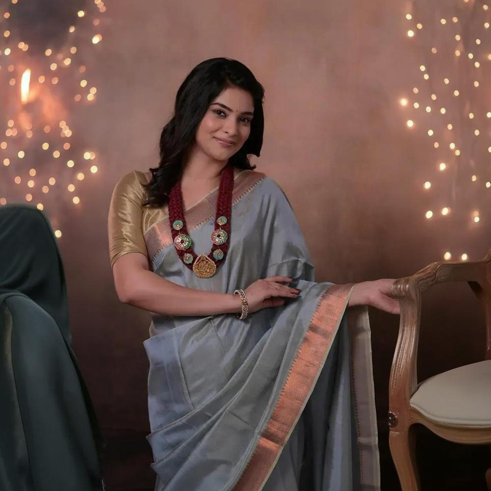 Bhadra - Powder Blue Plain Handwoven Silk Saree With Copper Zari Border