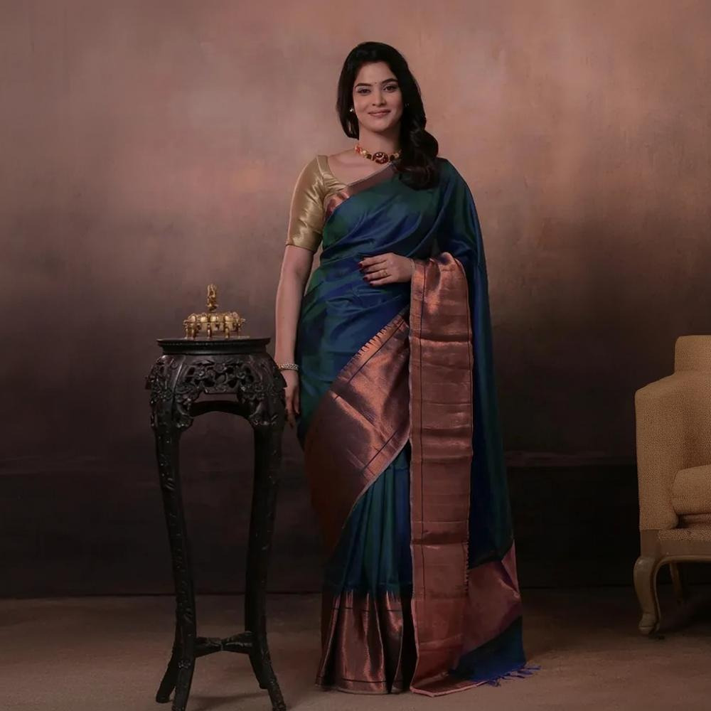 Bhadra - Teal Blue Plain Handwoven Silk Saree With Copper Zari Border
