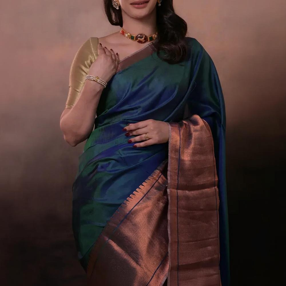 Bhadra - Teal Blue Plain Handwoven Silk Saree With Copper Zari Border