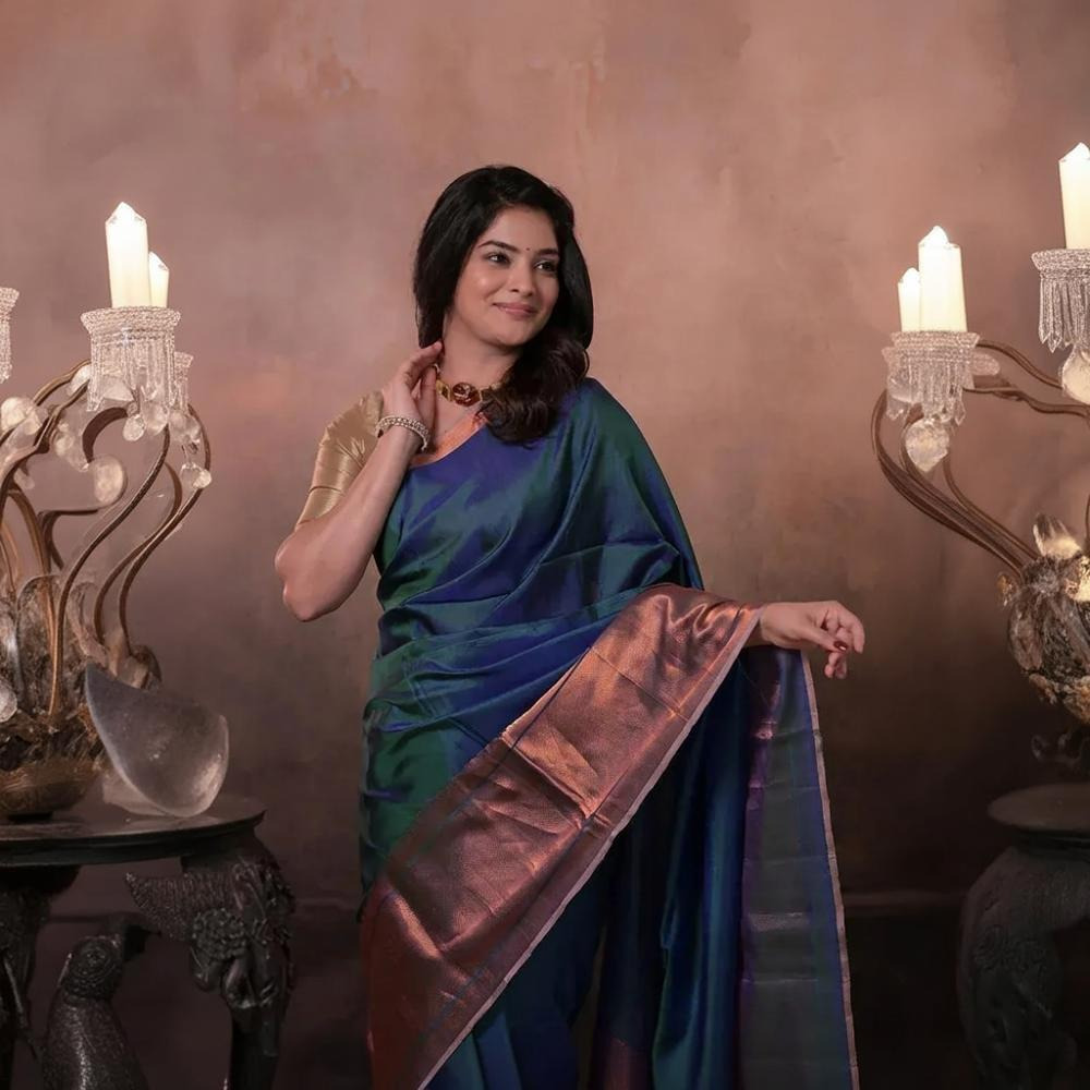 Bhadra - Teal Blue Plain Handwoven Silk Saree With Copper Zari Border