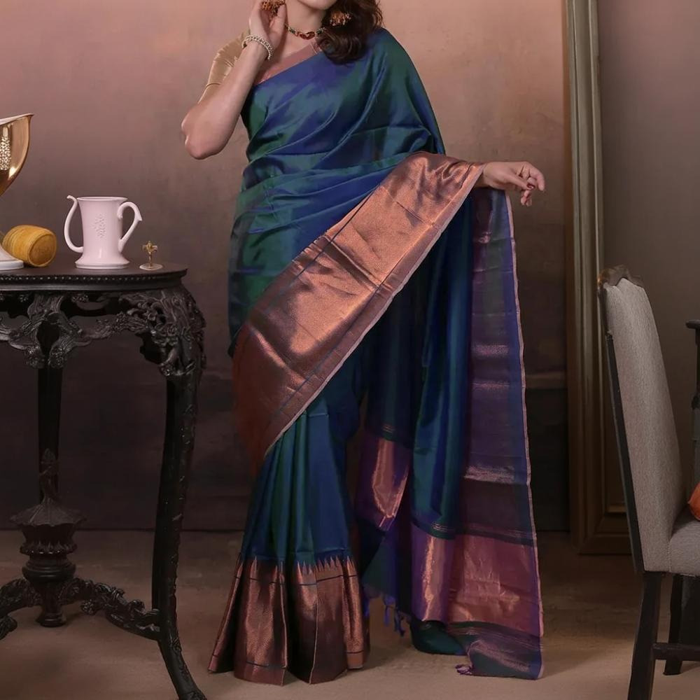 Bhadra - Teal Blue Plain Handwoven Silk Saree With Copper Zari Border